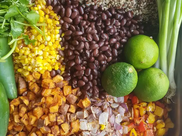 Quinoa, black beans, roasted corn, sweet potato and peppers in a catering pan