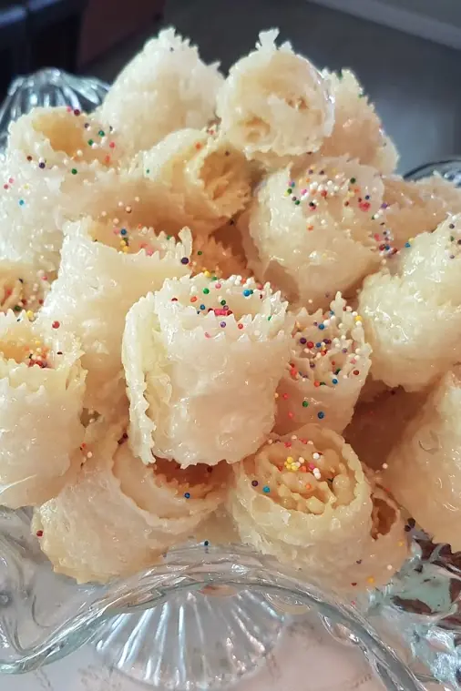 Moroccan pastries with colourful sprinkles in a glass dish